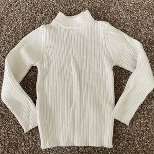 White ribbed turtle neck sweater